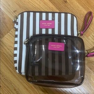 Set of two striped Henri Bendel cosmetic cases.